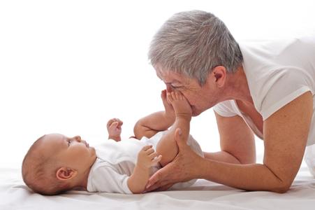 © Nonmim | Dreamstime.com - Grandmother Playing With A Baby Photo